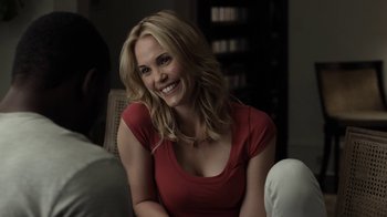 Movie still from “No Good Deed” (2014), directed by Sam Miller – A beautiful blonde woman sitting on a couch; Close Up shot, Over the shoulder angle