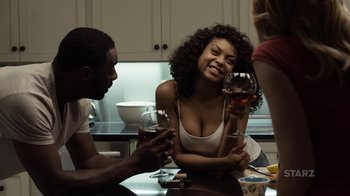Movie still from “No Good Deed” (2014), directed by Sam Miller – Three people sitting at a table drinking wine; Medium shot, Over the shoulder angle