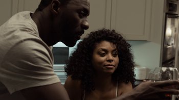 Movie still from “No Good Deed” (2014), directed by Sam Miller – A man and a woman looking at each other in a kitchen; Close Up shot, Over the shoulder angle