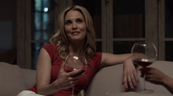 Movie still from “No Good Deed” (2014), directed by Sam Miller – A woman in a red dress holding a glass of wine; Close Up shot, Over the shoulder angle