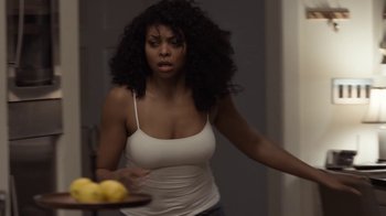 Movie still from “No Good Deed” (2014), directed by Sam Miller – A woman in a white shirt holding a plate of fruit; Medium shot, Over the shoulder angle