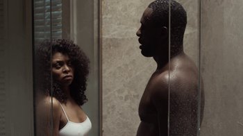 Movie still from “No Good Deed” (2014), directed by Sam Miller – A man and a woman standing in front of a shower; Medium shot, Over the shoulder angle