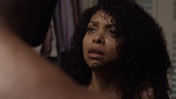 Movie still from “No Good Deed” (2014), directed by Sam Miller – A person with curly hair crying; Close Up shot, Over the shoulder angle
