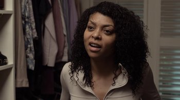 Movie still from “No Good Deed” (2014), directed by Sam Miller – A person with curly black hair; Close Up shot, Over the shoulder angle