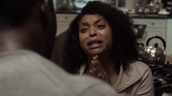 Movie still from “No Good Deed” (2014), directed by Sam Miller – A woman with curly hair looking in the mirror; Close Up shot, Over the shoulder angle
