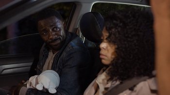Movie still from “No Good Deed” (2014), directed by Sam Miller – A man and a woman sitting in the back of a car; Close Up shot, Over the shoulder angle