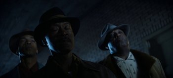 Movie still from “No Sudden Move” (2021), directed by Steven Soderbergh – A couple of men wearing hats standing next to each other; Close Up shot, Low angle
