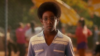 Movie still from “Norbit” (2007), directed by Brian Robbins – A young man wearing glasses and a blue shirt; Close Up shot, High angle