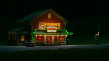 Movie still from “Norbit” (2007), directed by Brian Robbins – A car parked in front of a building at night; Extreme Wide shot, High angle