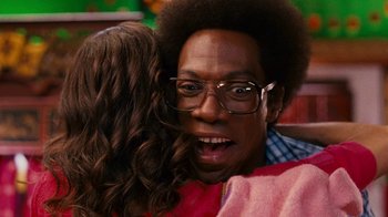 Movie still from “Norbit” (2007), directed by Brian Robbins – A person with glasses; Close Up shot, Over the shoulder angle