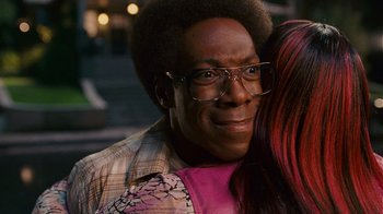 Movie still from “Norbit” (2007), directed by Brian Robbins – A person wearing glasses and a plaid shirt; Close Up shot, Over the shoulder angle