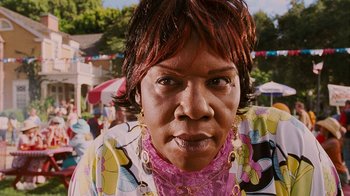 Movie still from “Norbit” (2007), directed by Brian Robbins – A person wearing a colorful shirt; Close Up shot, Low angle