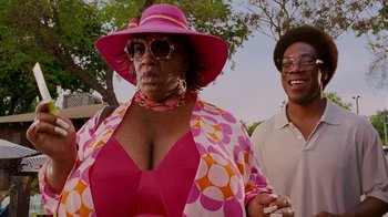 Movie still from “Norbit” (2007), directed by Brian Robbins – A woman in a pink hat and a man in a polka dot shirt; Close Up shot, Low angle