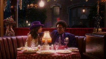 Movie still from “Norbit” (2007), directed by Brian Robbins – A man and a woman sitting at a dinner table; Medium shot, Over the shoulder angle