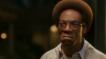 Movie still from “Norbit” (2007), directed by Brian Robbins – A person wearing glasses and a beard; Close Up shot, Low angle