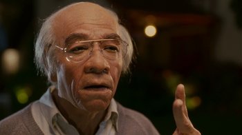 Movie still from “Norbit” (2007), directed by Brian Robbins – An old man with glasses is looking at the camera; Close Up shot, Low angle
