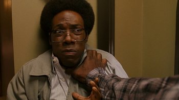 Movie still from “Norbit” (2007), directed by Brian Robbins – A man with glasses looking at himself in the mirror; Close Up shot, Over the shoulder angle