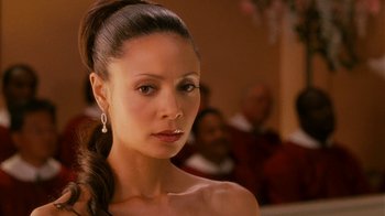 Movie still from “Norbit” (2007), directed by Brian Robbins – A person wearing a dress; Close Up shot, Over the shoulder angle