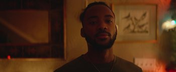 Movie still from “Mother/Android” (2021), directed by Mattson Tomlin – A person with a beard; Close Up shot, Over the shoulder angle