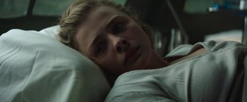 Movie still from “Mother/Android” (2021), directed by Mattson Tomlin – A person laying in a bed; Close Up shot, Low angle