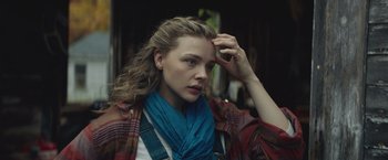 Movie still from “Mother/Android” (2021), directed by Mattson Tomlin – A woman with a blue scarf on her head; Close Up shot, Over the shoulder angle