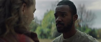 Movie still from “Mother/Android” (2021), directed by Mattson Tomlin – A man and a woman talking to each other outside; Close Up shot, Over the shoulder angle