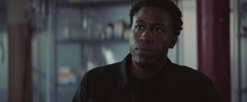 Movie still from “Mother/Android” (2021), directed by Mattson Tomlin – A person looking up at something; Close Up shot, Low angle