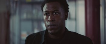 Movie still from “Mother/Android” (2021), directed by Mattson Tomlin – A person looking at the camera; Close Up shot, Low angle