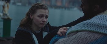 Movie still from “Mother/Android” (2021), directed by Mattson Tomlin – A woman holding a blanket in her hands; Close Up shot, Over the shoulder angle