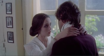 Movie still from “Nosferatu the Vampyre” (1979), directed by Werner Herzog – A woman and a young man in front of a window; Close Up shot, Over the shoulder angle