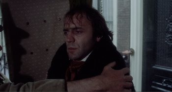 Movie still from “Nosferatu the Vampyre” (1979), directed by Werner Herzog – A man in a suit and tie hugging another man; Close Up shot, Over the shoulder angle