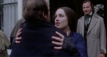 Movie still from “Nosferatu the Vampyre” (1979), directed by Werner Herzog – A man and a woman embracing each other outside; Close Up shot, Over the shoulder angle