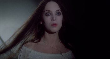 Movie still from “Nosferatu the Vampyre” (1979), directed by Werner Herzog – A beautiful woman with long dark brown hair and blue eyes; Close Up shot, Low angle