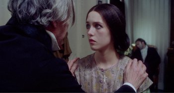 Movie still from “Nosferatu the Vampyre” (1979), directed by Werner Herzog – A young girl is being comforted by an older man; Close Up shot, Over the shoulder angle