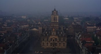 Movie still from “Nosferatu the Vampyre” (1979), directed by Werner Herzog – An aerial view of an old building in a city; Extreme Wide shot, High angle