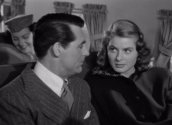 Movie still from “Notorious” (1946), directed by Alfred Hitchcock – A black and white photo of a man and a woman; Close Up shot, Over the shoulder angle