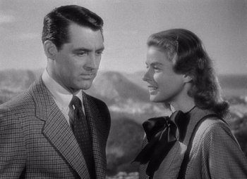 Movie still from “Notorious” (1946), directed by Alfred Hitchcock – A black and white photo of a man and a woman; Close Up shot, Low angle