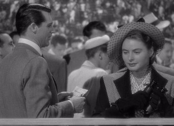 Movie still from “Notorious” (1946), directed by Alfred Hitchcock – A man and a woman are talking to each other; Close Up shot, Over the shoulder angle