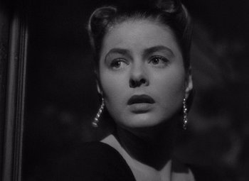 Movie still from “Notorious” (1946), directed by Alfred Hitchcock – A black and white photo of a woman in a black dress; Close Up shot, Low angle