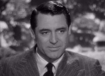 Movie still from “Notorious” (1946), directed by Alfred Hitchcock – A black - and - white photo of cary grant; Close Up shot, Over the shoulder angle