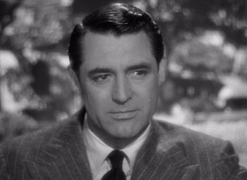 Movie still from “Notorious” (1946), directed by Alfred Hitchcock – An old black and white photo of cary grant; Close Up shot, Over the shoulder angle
