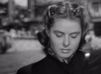 Movie still from “Notorious” (1946), directed by Alfred Hitchcock – A black and white photo of a woman with her eyes closed; Close Up shot, High angle