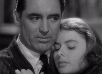 Movie still from “Notorious” (1946), directed by Alfred Hitchcock – A black and white photo of a man and a woman; Close Up shot, Low angle