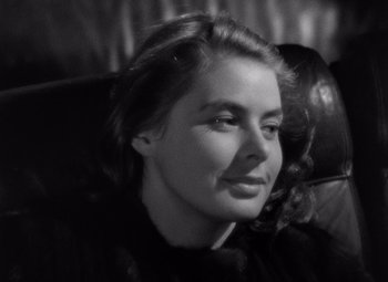 Movie still from “Notorious” (1946), directed by Alfred Hitchcock – Black and white photograph of a woman in a car seat; Close Up shot, High angle