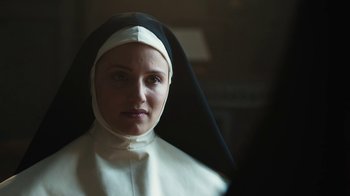 Movie still from “Novitiate” (2017), directed by Maggie Betts – A woman in a nun's outfit looking at the camera; Close Up shot, Over the shoulder angle