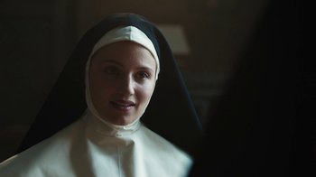 Movie still from “Novitiate” (2017), directed by Maggie Betts – A woman in a nun's outfit looking at the camera; Close Up shot, Over the shoulder angle