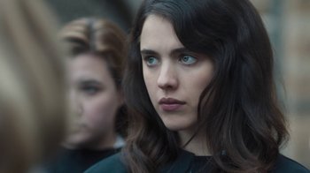 Movie still from “Novitiate” (2017), directed by Maggie Betts – A woman with blue eyes and long dark brown hair; Close Up shot, Over the shoulder angle
