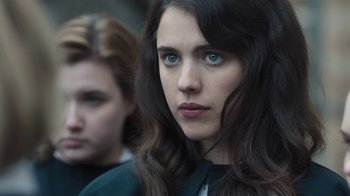 Movie still from “Novitiate” (2017), directed by Maggie Betts – A woman with long hair and blue eyes looking at the camera; Close Up shot, Over the shoulder angle