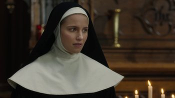 Movie still from “Novitiate” (2017), directed by Maggie Betts – A woman in a nun's habit looking at the camera; Close Up shot, Over the shoulder angle