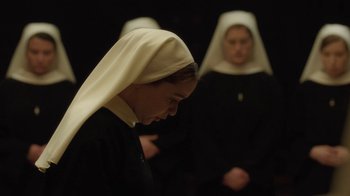 Movie still from “Novitiate” (2017), directed by Maggie Betts – Two women dressed in black and white standing next to each other; Close Up shot, Low angle